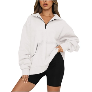 Women's oversized white half-zip sweatshirt with kangaroo pocket and relaxed drop shoulders