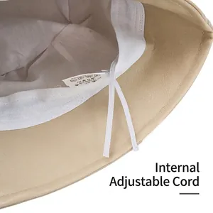 Adjustable beige PU leather bucket hat interior view with drawstrings and soft lining