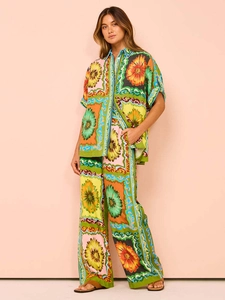 Detail of bohemian floral print matching set with short sleeve shirt and wide-leg trousers