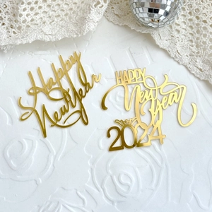 Golden acrylic Happy New Year cake toppers with mirror finish for holiday baking decor