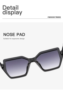 Close-up of ergonomic integrated nose pads on black geometric gradient sunglasses