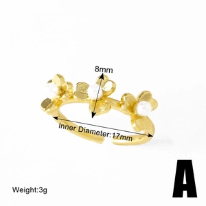 Detail view of gold floral open ring showing 8mm flower width and 17mm inner diameter