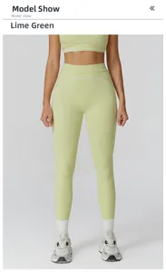 Detail of high-waisted lime green yoga leggings with white contrast stitching accents