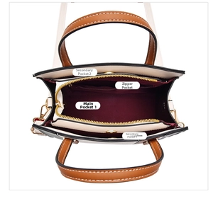 Top view of color-block handbag showing spacious wine red interior with multiple pockets
