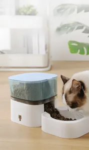 Close-up of the transparent storage bin and gravity-fed dry food outlet for pets