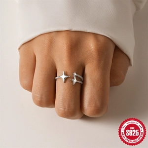 Elegant S925 sterling silver open star ring with woven texture on model's hand