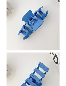 Detail shot of the matte blue square hair claw clip with a textured frosted finish