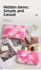 Detail of pink gradient makeup bag with quilted wave pattern and star butterfly print