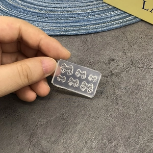 Transparent silicone mold featuring multiple bow shapes for DIY handmade nail art tools