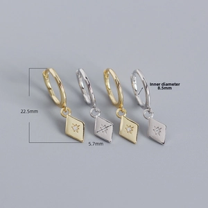 Detailed size view of silver and gold geometric rhombic earrings with starburst zircon