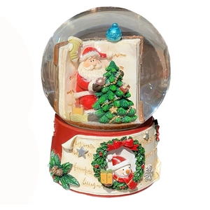 Christmas snow globe music box with Santa decorating tree and festive red base
