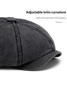 Detail of dark grey washed cotton newsboy cap featuring a flexible foldable brim design