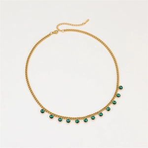 Detail of gold-plated stainless steel necklace with green crystals and lobster clasp