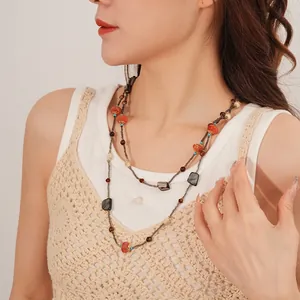 Ethnic layered necklace with shells, agate, and wooden beads in vintage bohemian style