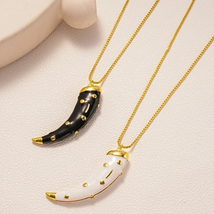 Retro cornicello horn pendant necklace with gold dots in black and white enamel
