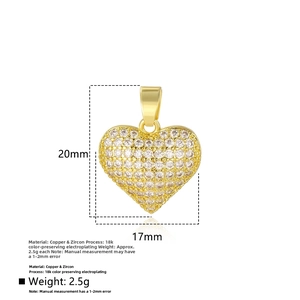 Macro view of 18k gold plated heart pendant with white zircon inlay and 20mm height