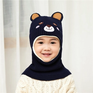 Close-up of kids knitted winter hooded scarf with bear ears in navy blue color