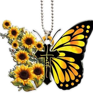 Macro detail of acrylic sunflower butterfly cross pendant with faith text and chain