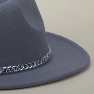 Detail of grey wool fedora hat featuring a chunky silver metal chain decorative band