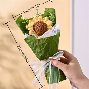 Handheld view showing dimensions of a handmade crochet sunflower bouquet with white mesh