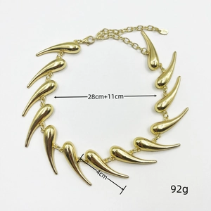 Detailed view of bold golden spike necklace with length and weight measurements