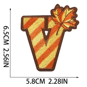 Detail view of letter V embroidery patch with maple leaf pattern and size measurements