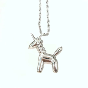 Detailed view of silver balloon unicorn pendant with polished metallic reflective finish