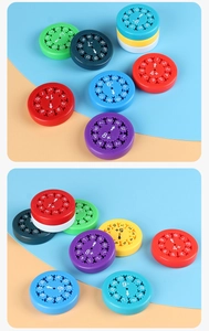 Detail view of colorful math learning fidget spinners with printed numbers and symbols