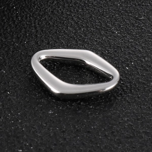 Polished stainless steel geometric hollow ring with unique organic shape on black texture