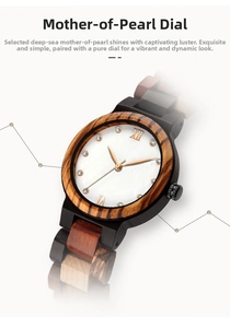Close-up of mother of pearl dial and zebra wood bezel on a luxury quartz watch