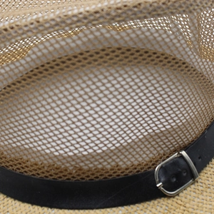 Macro detail of breathable mesh fabric and black leather strap with buckle on sun hat