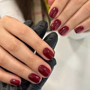 Glossy burgundy red press-on nails for women with a deep cherry finish and shine
