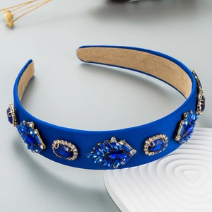 Detailed view of luxury royal blue velvet headband with sparkling crystal embellishments
