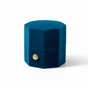 Navy blue octagonal velvet jewelry box for rings featuring a luxury gold metal clasp