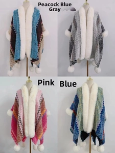 Close-up of four colorful knit shawls featuring faux fur collars and decorative pom-poms