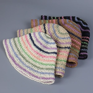 Detailed view of four colorful crochet bucket hats with striped patterns and woven texture