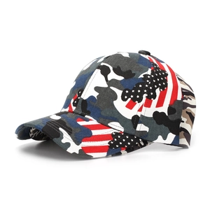 Detail view of camouflage baseball cap with American flag patchwork and curved brim