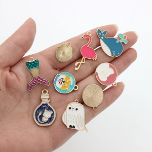 DIY colorful cartoon animal oil drop alloy charms set held in hand for jewelry making