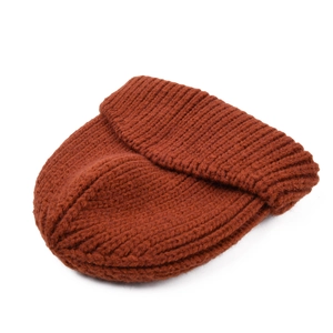 Close-up of caramel thick-knit beanie showing the ribbed texture and wide cuffed brim