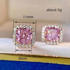 Detail view of pink square stone earrings with dimensions 11mm and 8mm on gold base