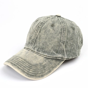 Detail view of washed cotton twill baseball cap showing vintage texture and stitching
