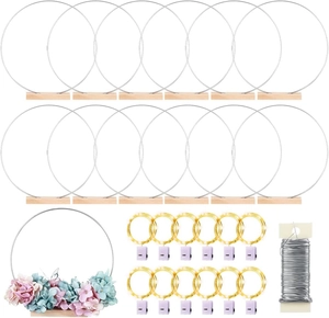 DIY wedding centerpiece set with silver metal rings, wooden bases, and warm LED light strings
