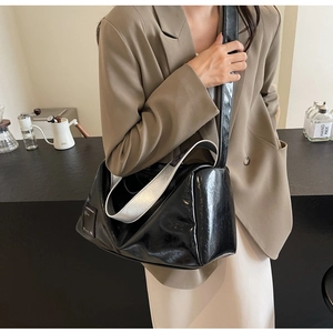 Chic black Boston bag detail with bicolor wide shoulder strap on casual outfit