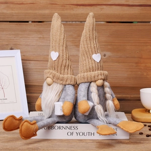 Handmade Christmas gnome plush dolls with knit hats on books for home decor