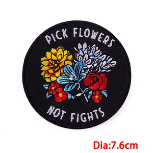 7.6cm round embroidery patch with colorful flowers and 'Pick Flowers Not Fights' text