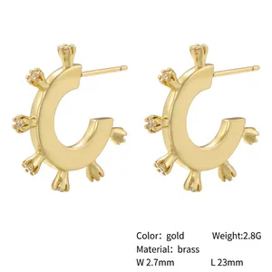 Elegant gold brass C-shaped hoop earrings with clear zircon stones on white background