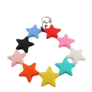 Detailed view of colorful star-shaped beads on a vibrant dopamine-style phone wrist strap