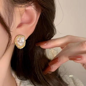 French vintage irregular pearl ear clips for women with gold trim and elegant aesthetic