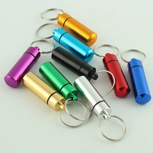 Portable waterproof aluminum pill box keychain storage capsules in nine vibrant colors