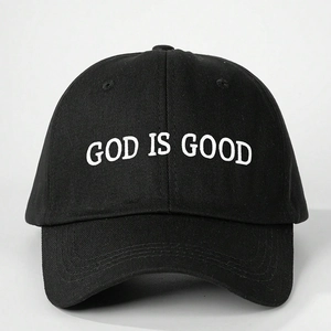 Classic black cotton baseball cap with white God Is Good embroidery in a 3D textured style